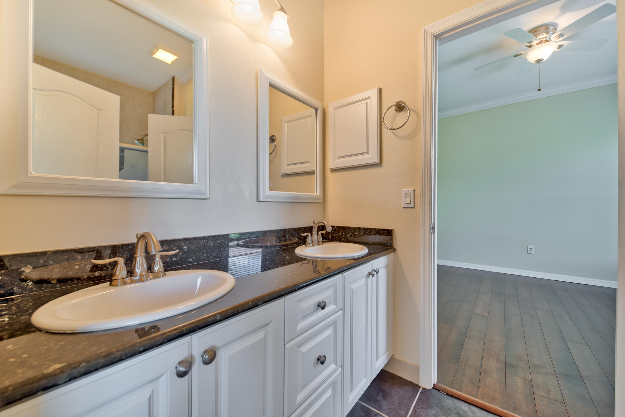 567 Southwest Spring Hill Point Port St. Lucie, FL 34986 - Photo 23 of 36 a bathroom with a sink and a mirror