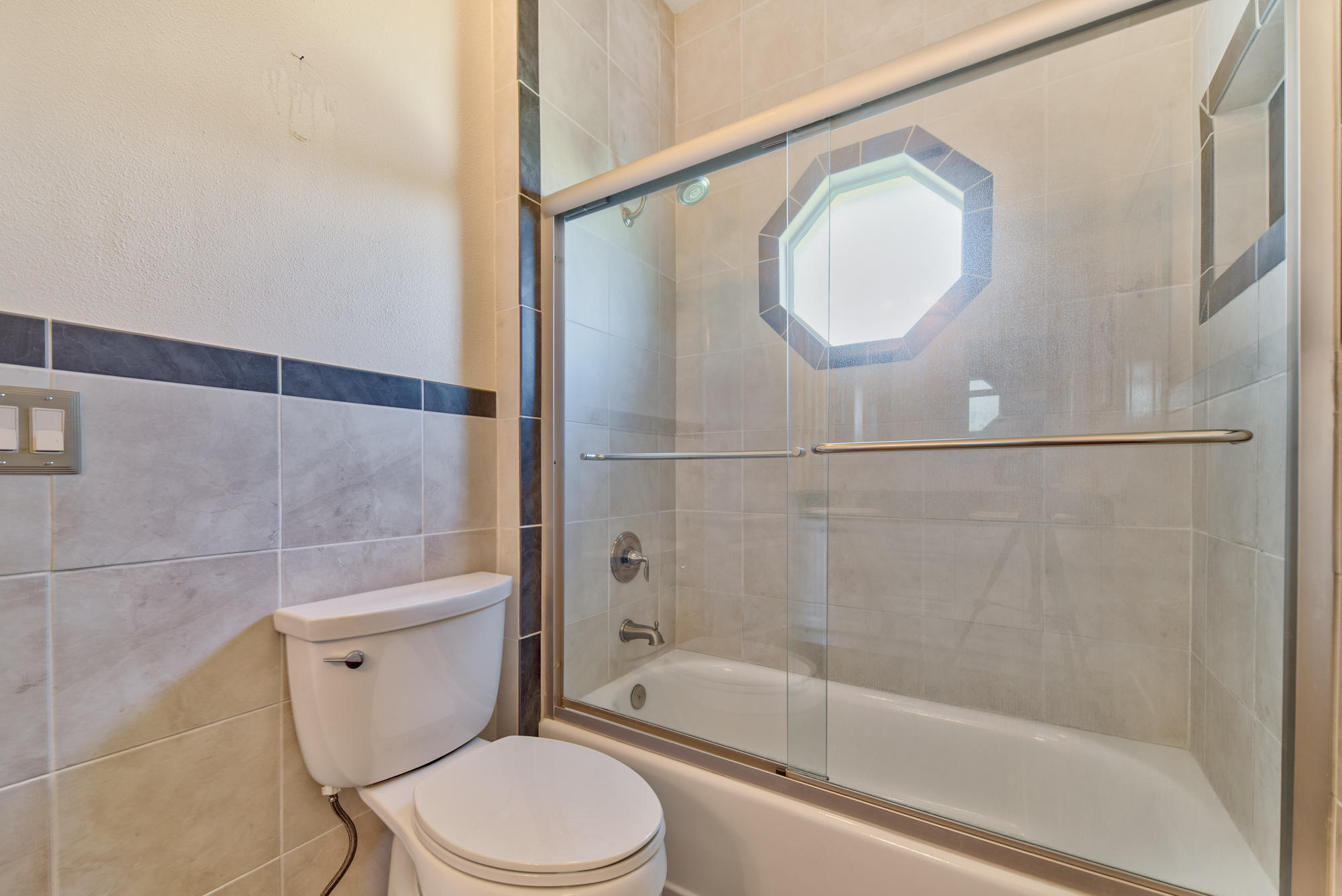 567 Southwest Spring Hill Point Port St. Lucie, FL 34986 - Photo 24 of 36 a bathroom with a toilet and a bathtub