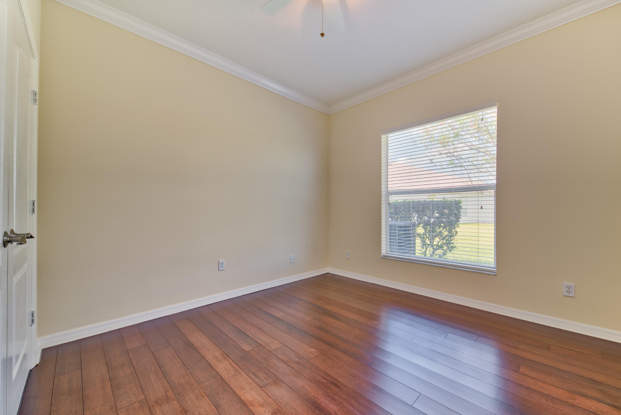 567 Southwest Spring Hill Point Port St. Lucie, FL 34986 - Photo 25 of 36 an empty room with wooden floor and a window
