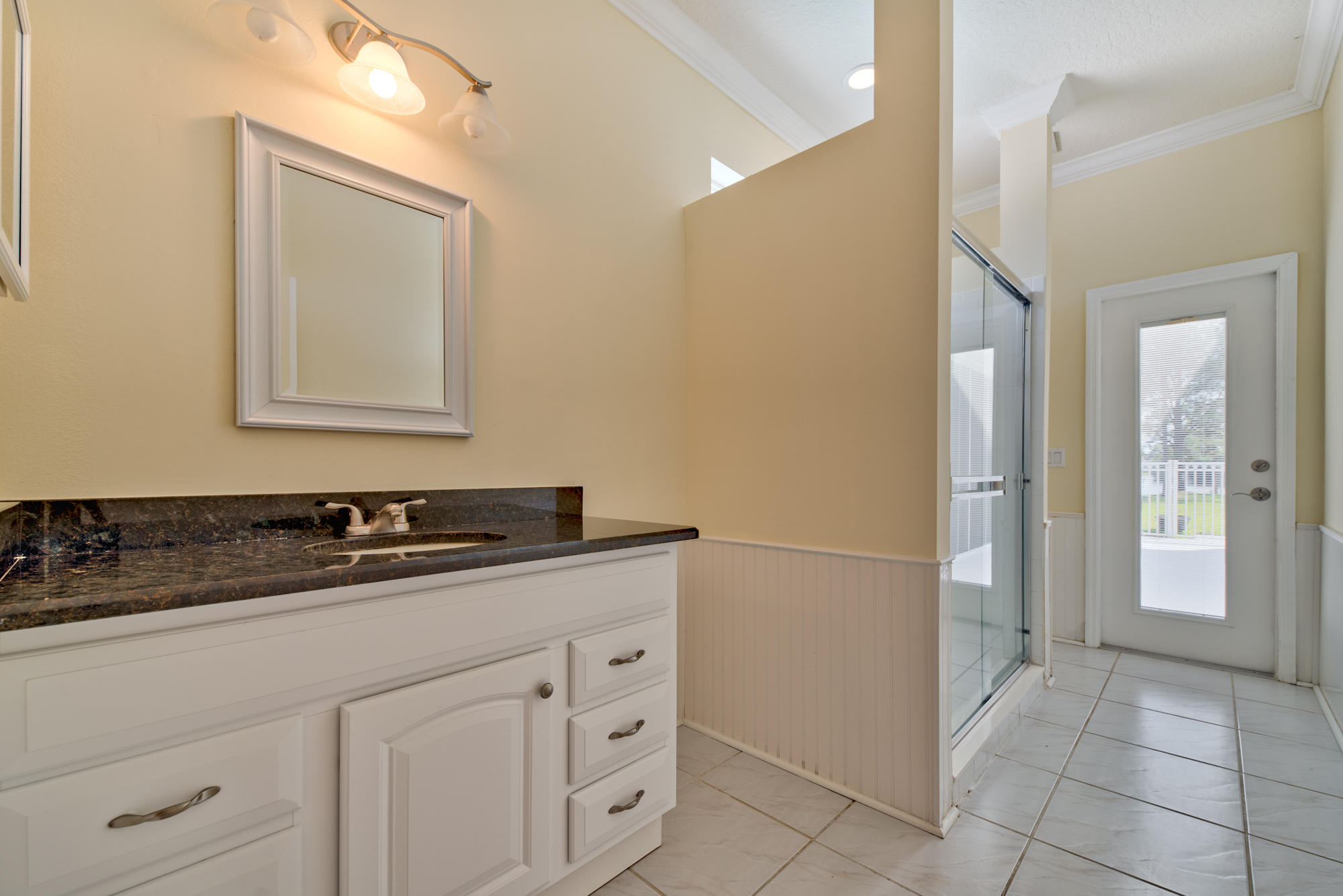 567 Southwest Spring Hill Point Port St. Lucie, FL 34986 - Photo 27 of 36 a bathroom with a sink and a mirror