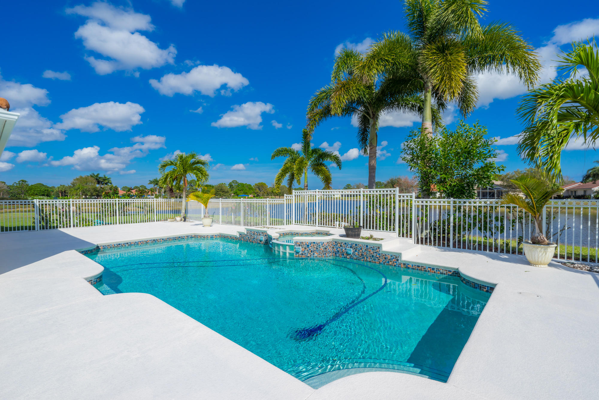 567 Southwest Spring Hill Point Port St. Lucie, FL 34986 - Photo 30 of 36 a view of a backyard with swimming pool