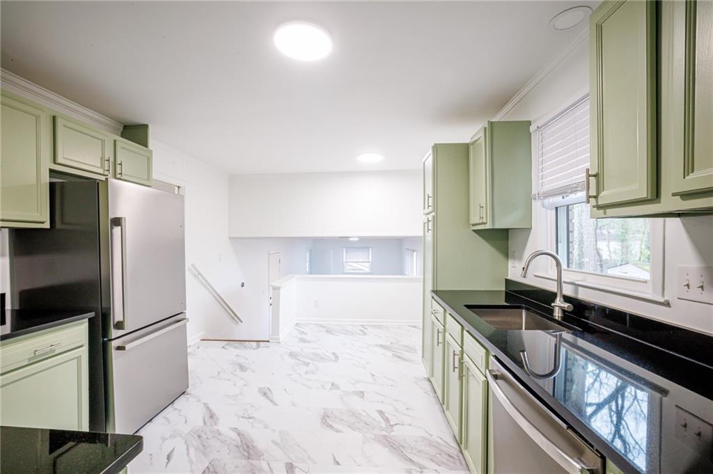 2692 Whites Mill Court Decatur, GA 30034 - Photo 11 of 33 a kitchen with a sink stove and refrigerator