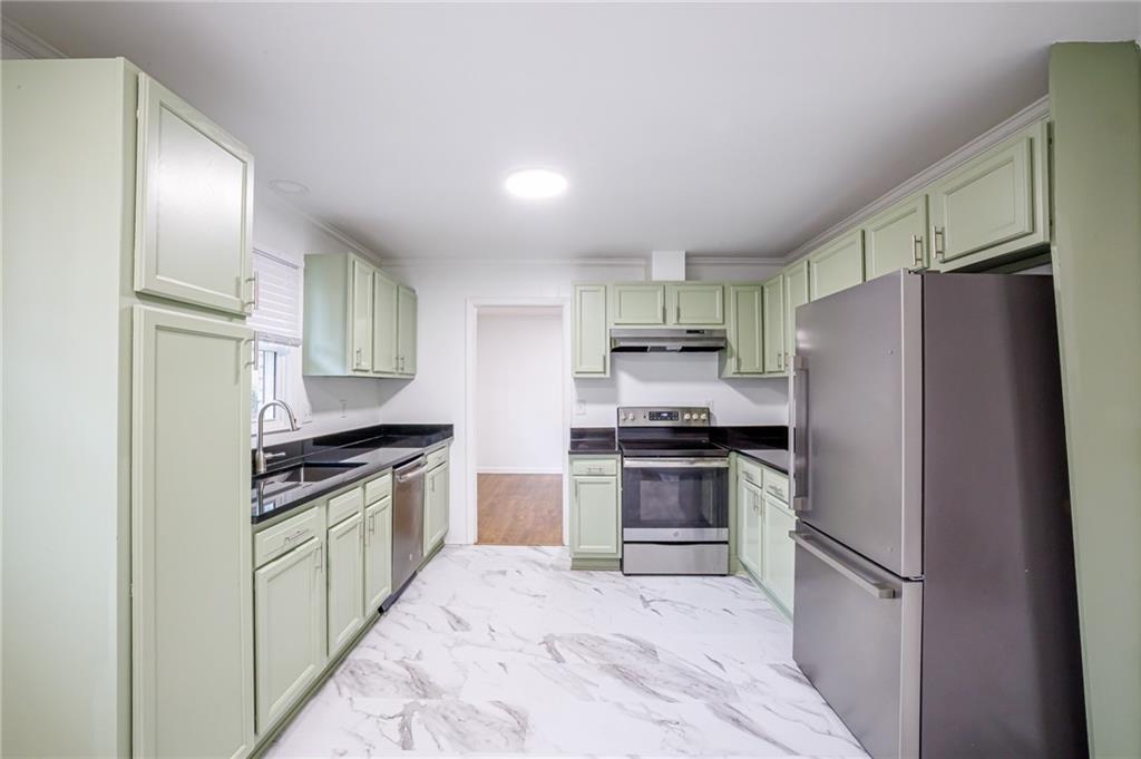 2692 Whites Mill Court Decatur, GA 30034 - Photo 12 of 33 a kitchen with stainless steel appliances granite countertop a refrigerator stove and sink