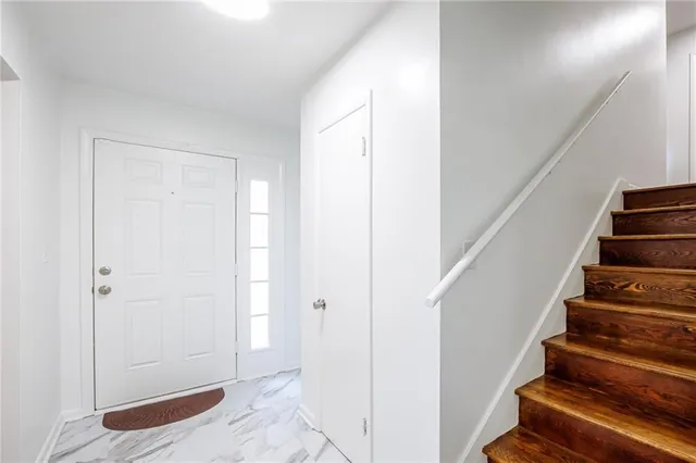 a view of entryway with stairs