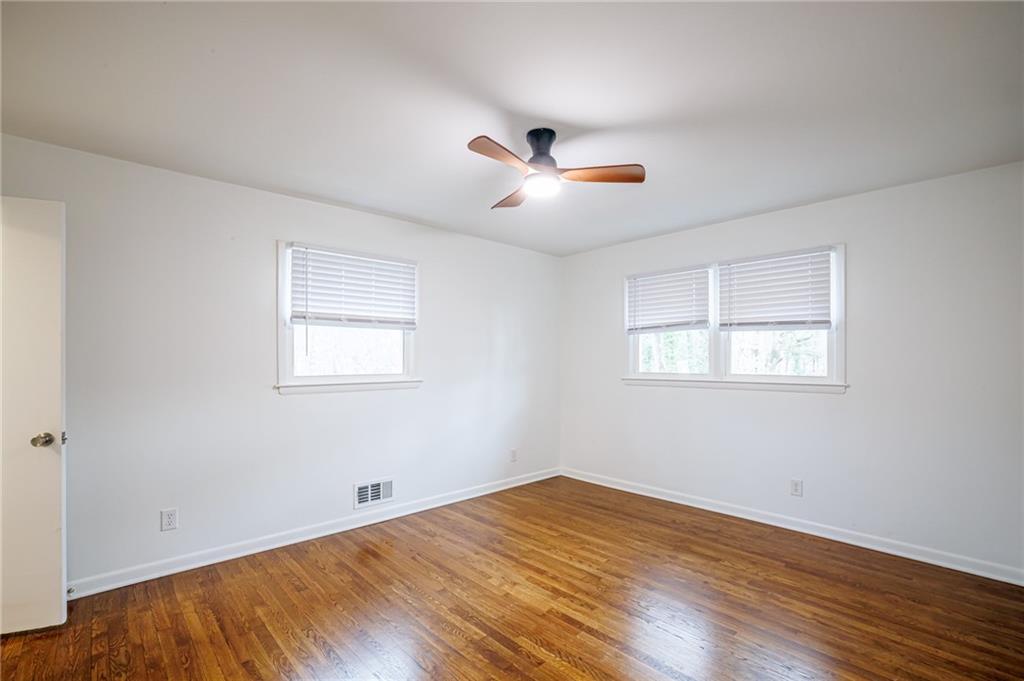 2692 Whites Mill Court Decatur, GA 30034 - Photo 22 of 33 a view of empty room with wooden floor and fan