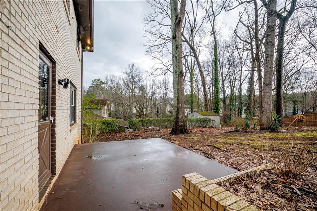 2692 Whites Mill Court Decatur, GA 30034 - Photo 30 of 33 a view of a street with trees on both side of it