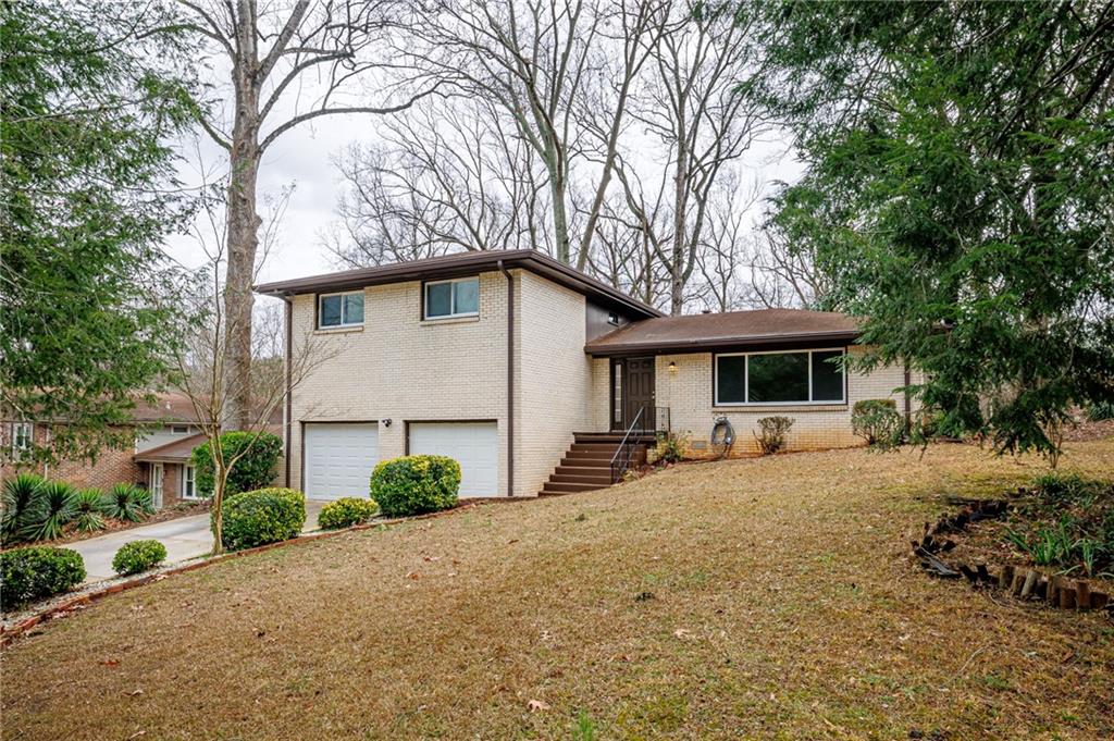 2692 Whites Mill Court Decatur, GA 30034 - Photo 33 of 33 a view of a house with a yard and trees