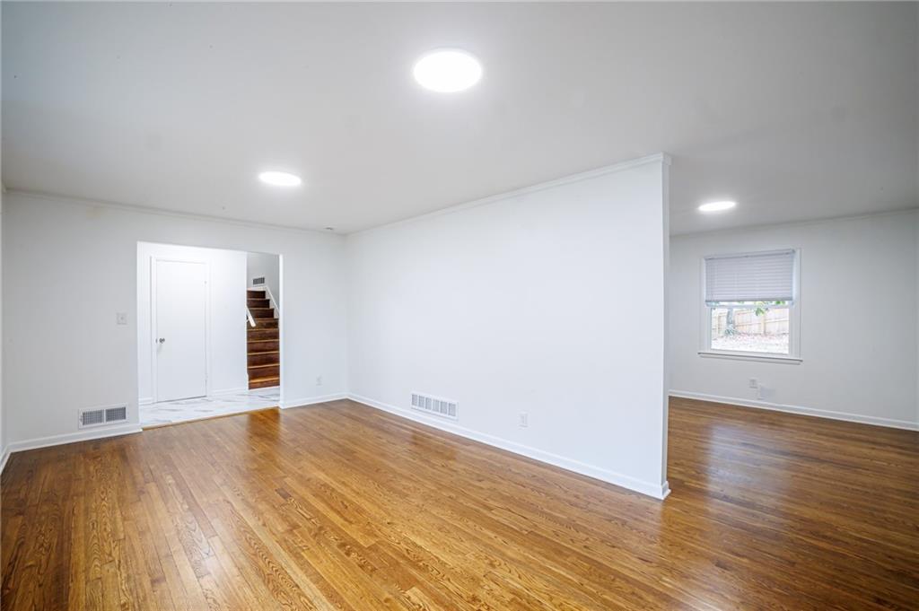 2692 Whites Mill Court Decatur, GA 30034 - Photo 7 of 33 an empty room with wooden floor and windows