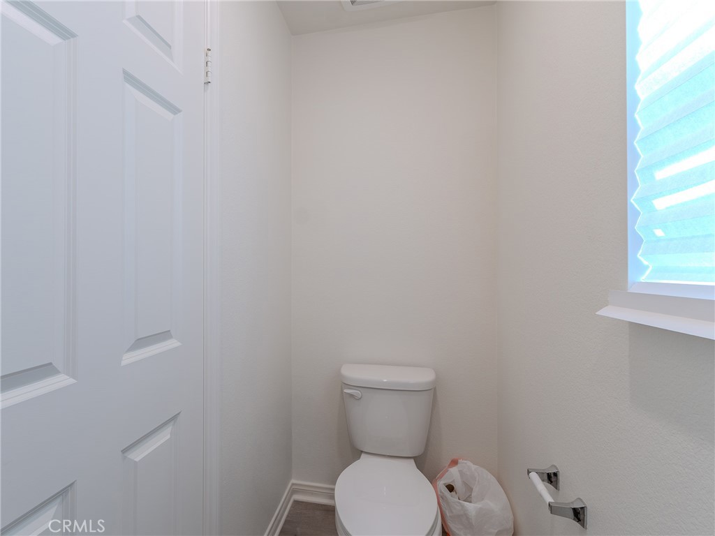 25602 Pne Rdg Road Homeland, CA 92548 - Photo 7 of 35 a white toilet sitting next to a window