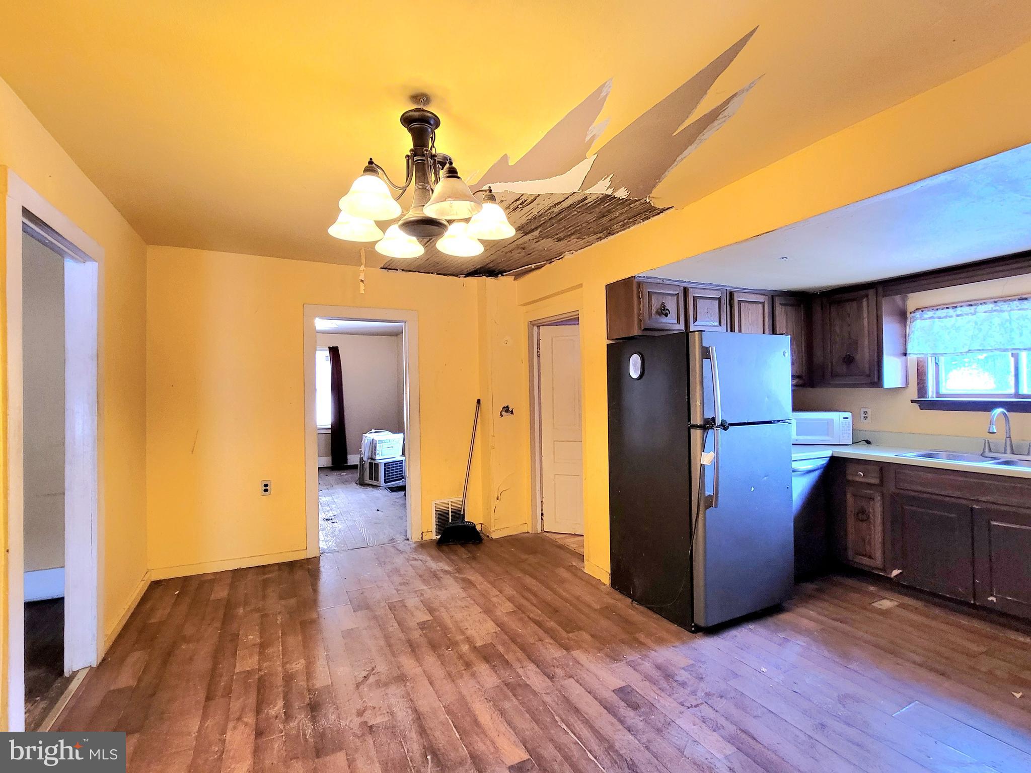 357 Spring Street Houtzdale, PA 16651 - Photo 13 of 19 a kitchen with stainless steel appliances granite countertop a refrigerator a stove and a wooden floors