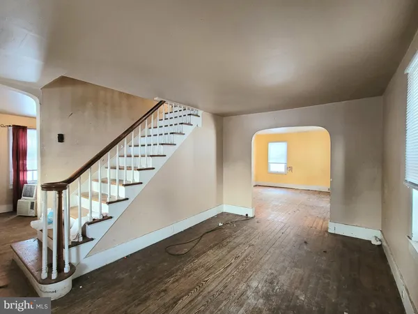 a view of an entryway with wooden floor