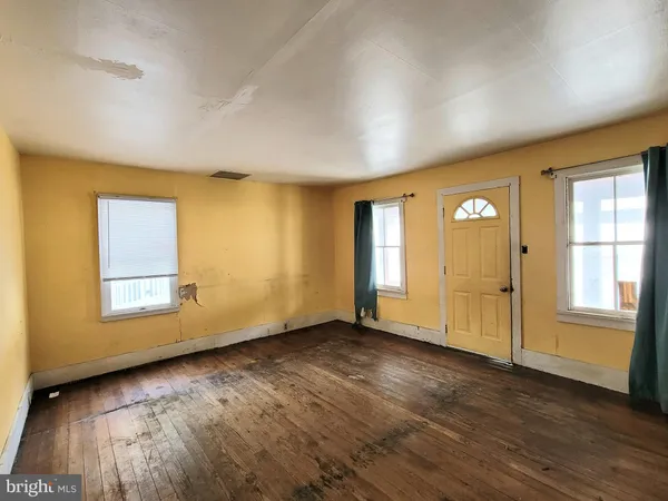 a view of a livingroom with wooden floor