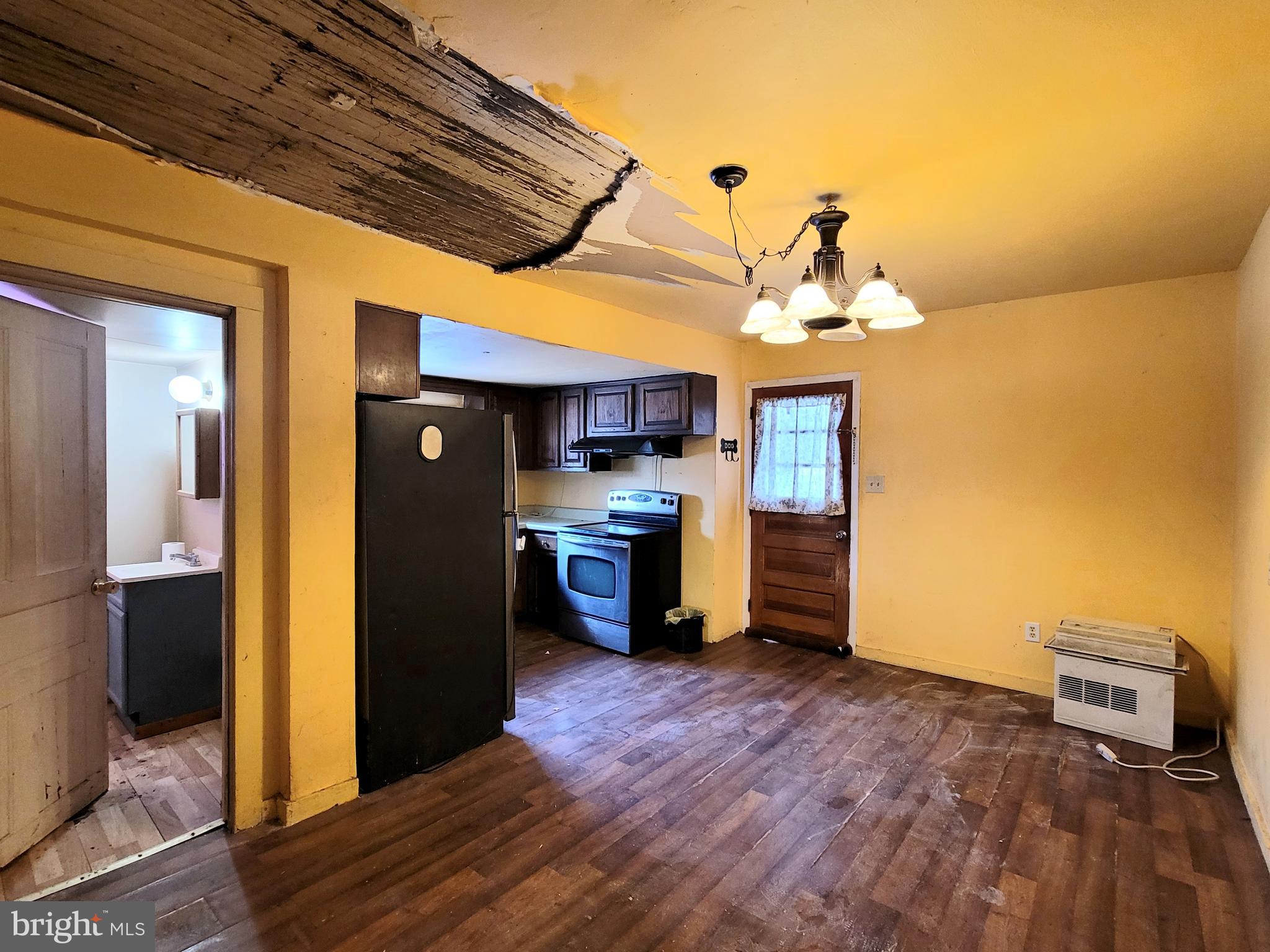 357 Spring Street Houtzdale, PA 16651 - Photo 10 of 19 a living room with stainless steel appliances kitchen island granite countertop a refrigerator a stove and a wooden floors