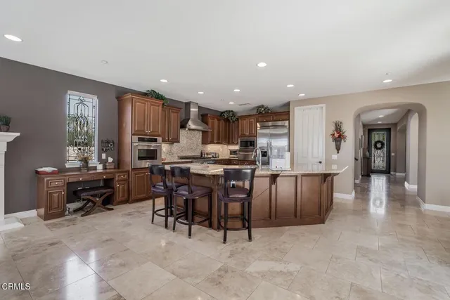a kitchen with a table and chairs in it