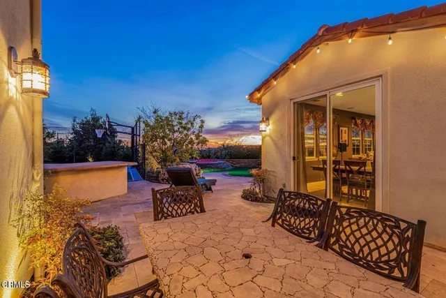 a view of swimming pool with outdoor seating and yard