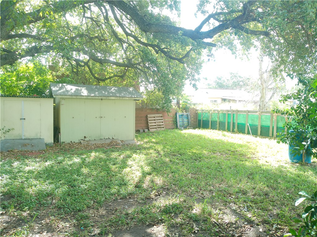 4322 Fir Street Corpus Christi, TX 78411 - Photo 15 of 17 a backyard of a house with a garden and plants