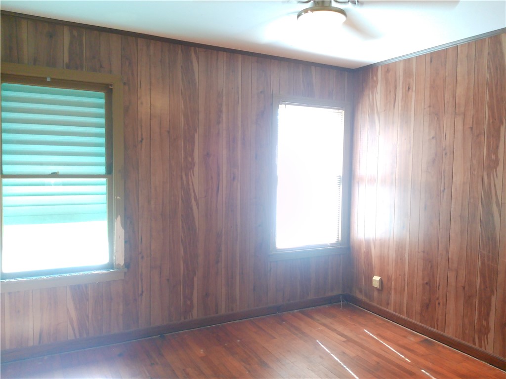 4322 Fir Street Corpus Christi, TX 78411 - Photo 9 of 17 a view of an empty room with wooden floor and a window