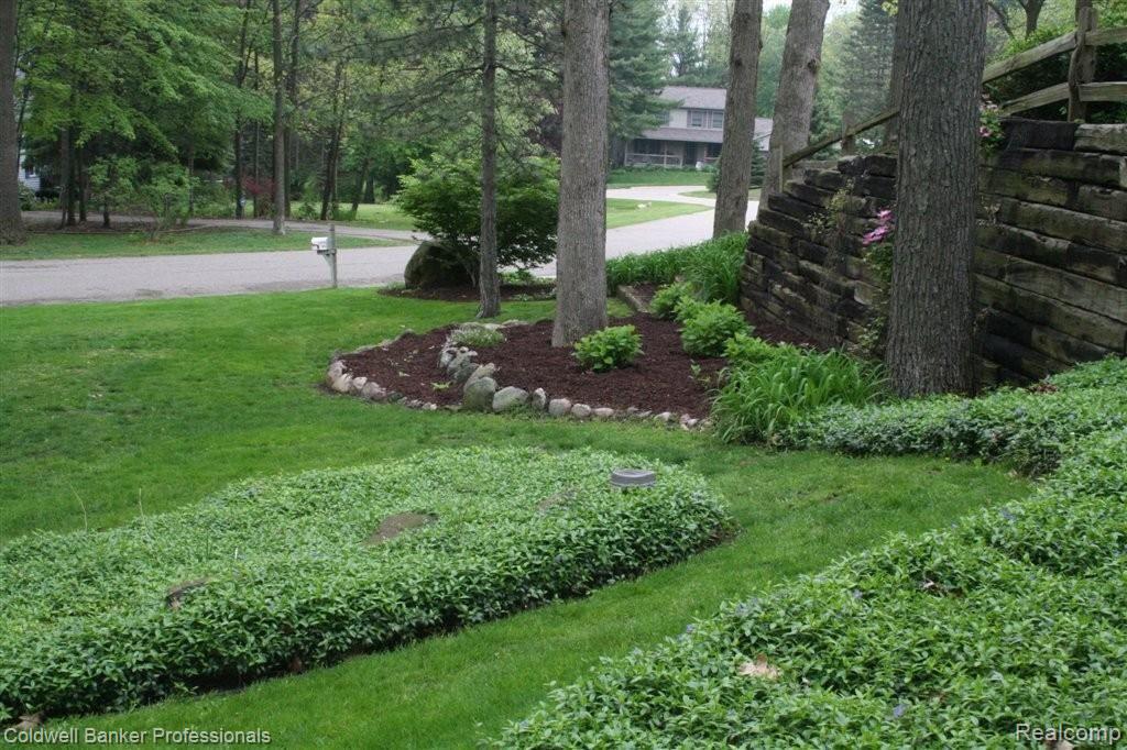 11168 Whispering Ridge Trail Fenton, MI 48430 - Photo 22 of 24 Manicured Lawn