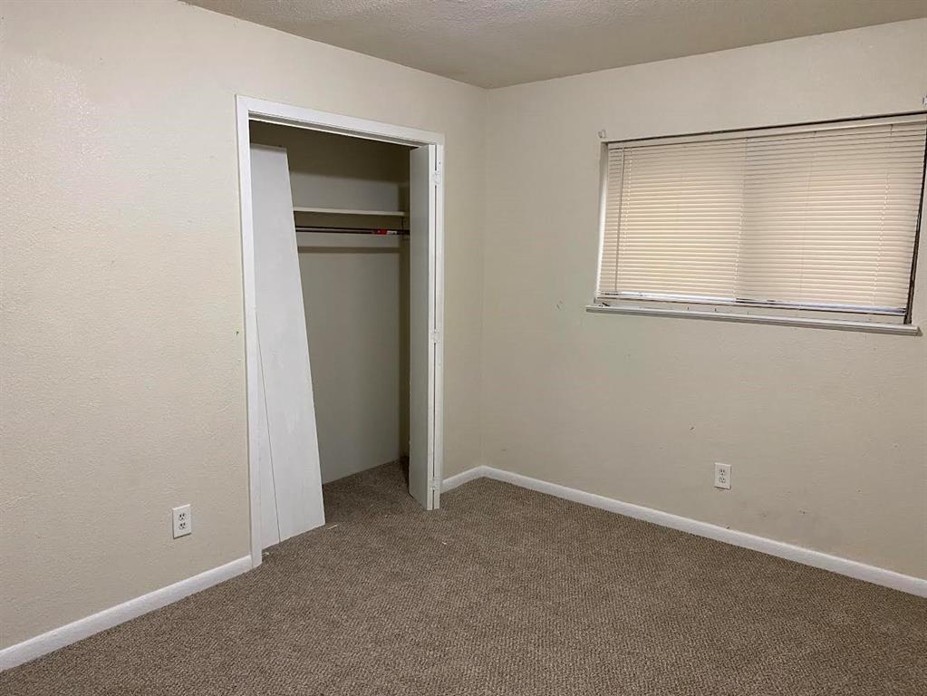 5105 Willie Street Fort Worth, TX 76105 - Photo 11 of 12 a view of an empty room with closet and a window