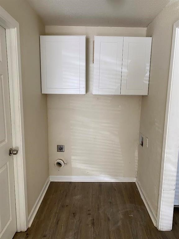 5105 Willie Street Fort Worth, TX 76105 - Photo 7 of 12 an empty room with wooden floor and cabinet