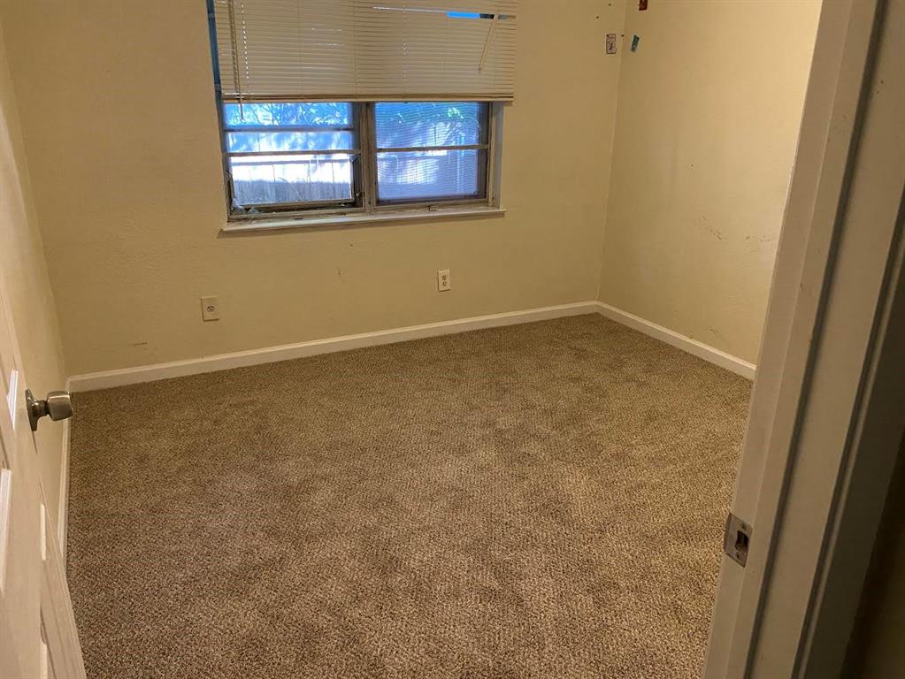 5105 Willie Street Fort Worth, TX 76105 - Photo 9 of 12 an empty room with a window