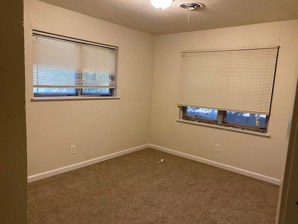 5105 Willie Street Fort Worth, TX 76105 - Photo 10 of 12 an empty room with a window