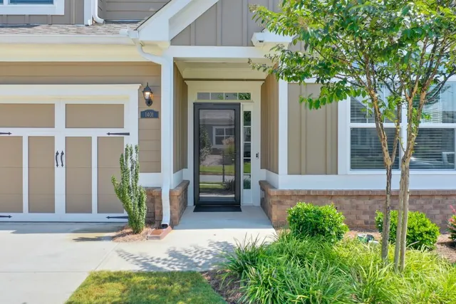 front view of a house with a small yard