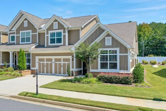 a front view of a house with a yard