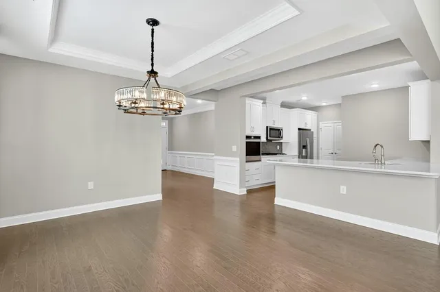 a view of a kitchen with a sink stainless steel appliances and cabinets