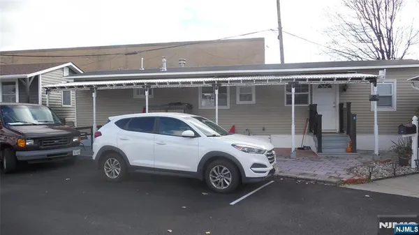 a car parked in front of a house