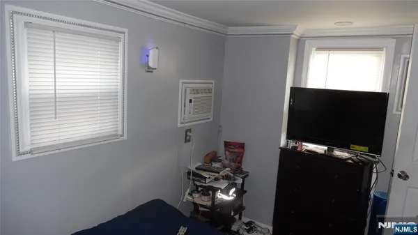 a view of storage and utility room with two washing machine
