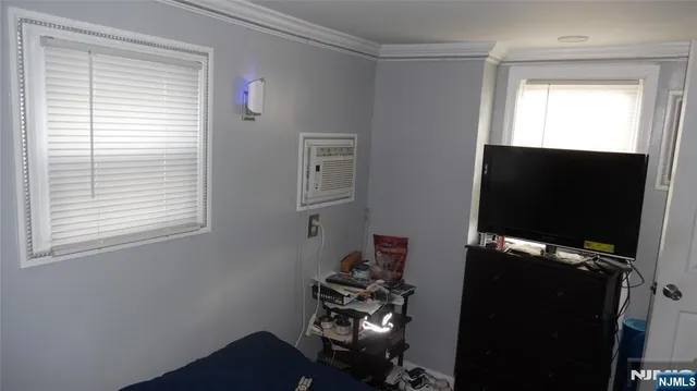 a view of storage and utility room with two washing machine