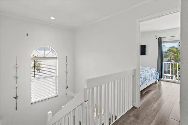 a bedroom with two beds and a window