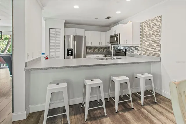 a view of a room with furniture window and wooden floor