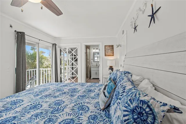 a bedroom with a large bed and a flat tv screen