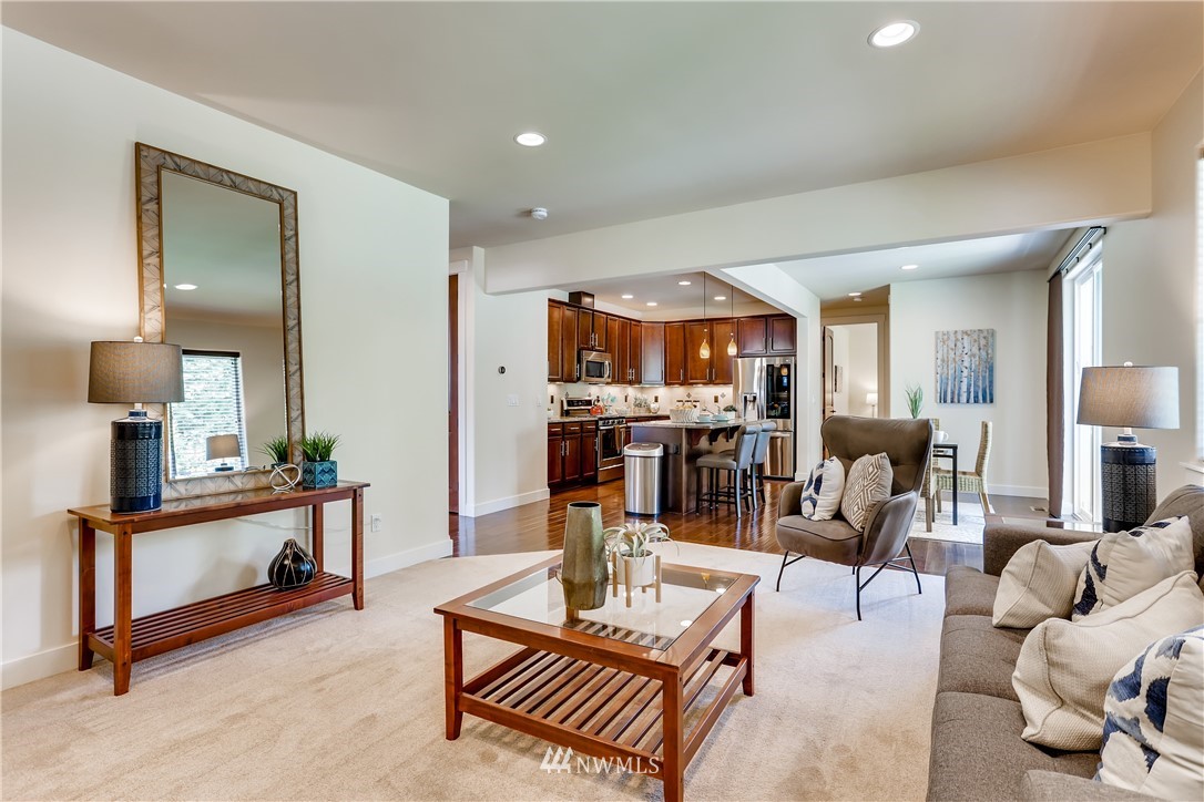 9 233rd Place Southeast Bothell, WA 98021 - Photo 14 of 36 a living room with furniture and a view of kitchen