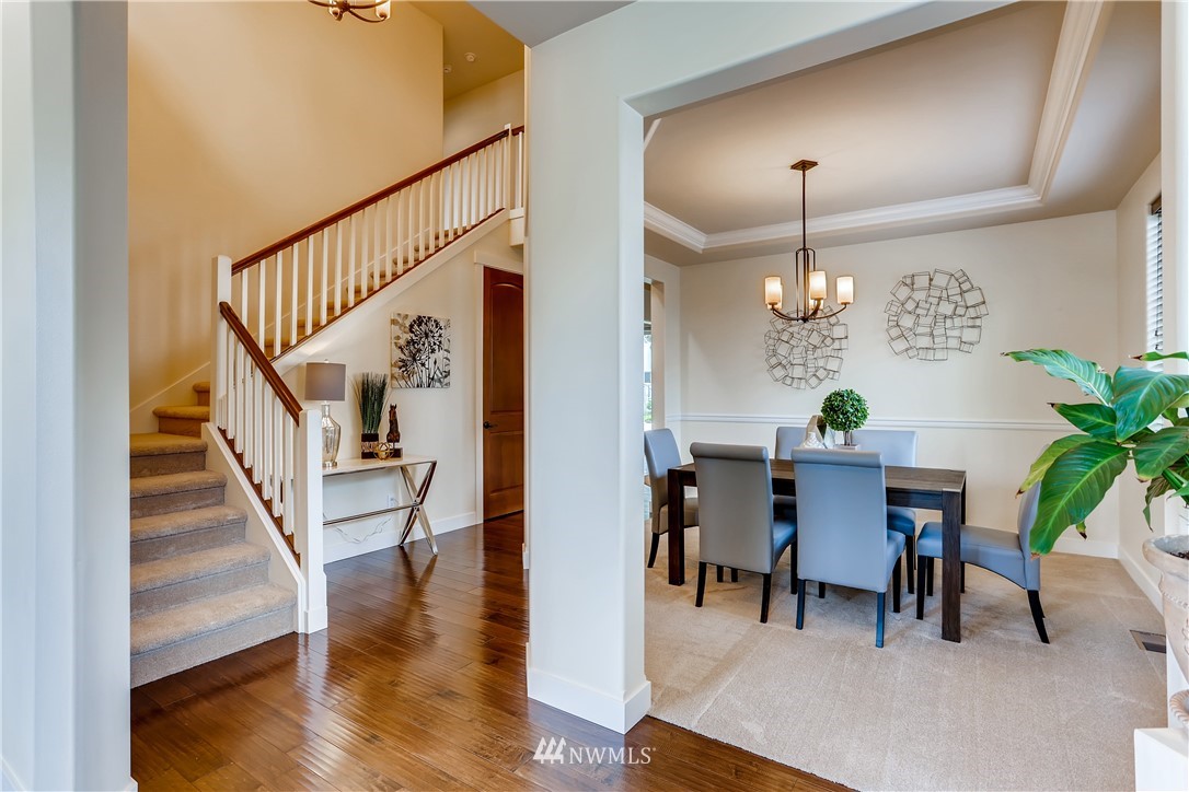 9 233rd Place Southeast Bothell, WA 98021 - Photo 3 of 36 a view of a dining room with furniture and wooden floor