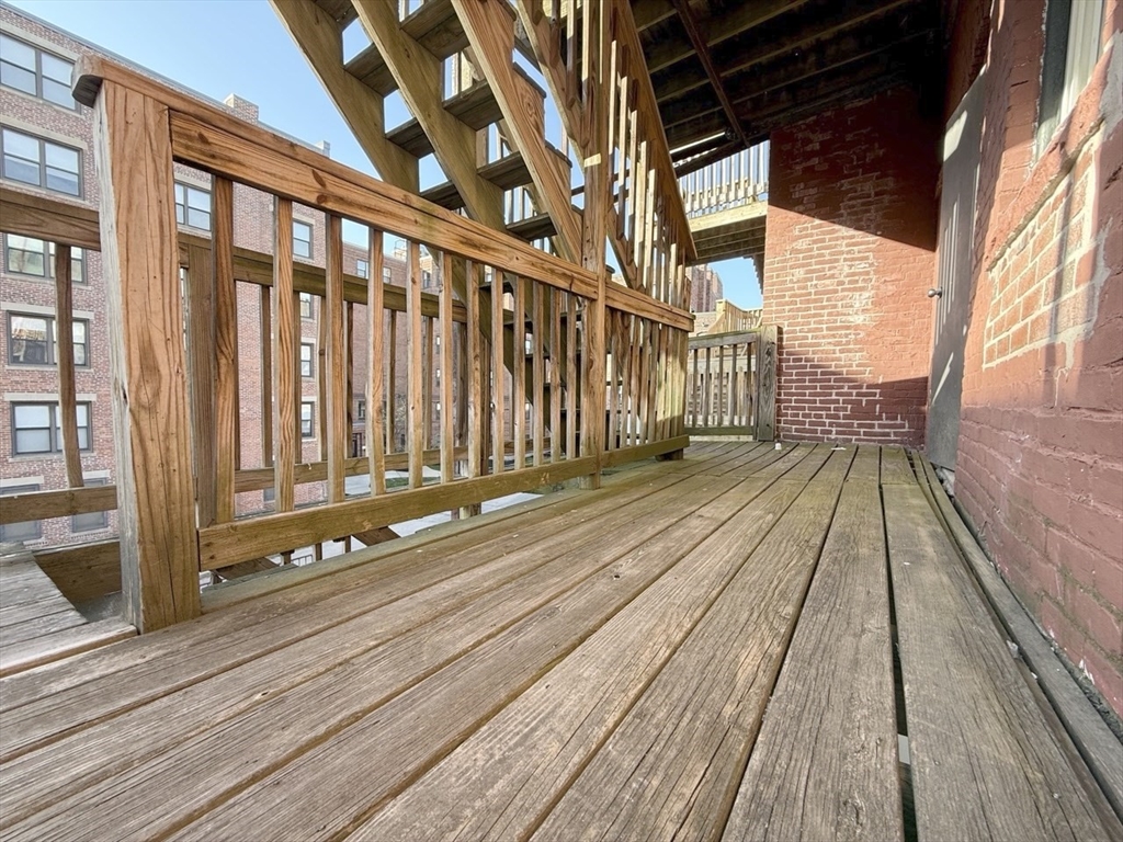 11 Vancouver Street, Unit 2 Boston, MA 02115 - Photo 13 of 14 a view of balcony with wooden floor