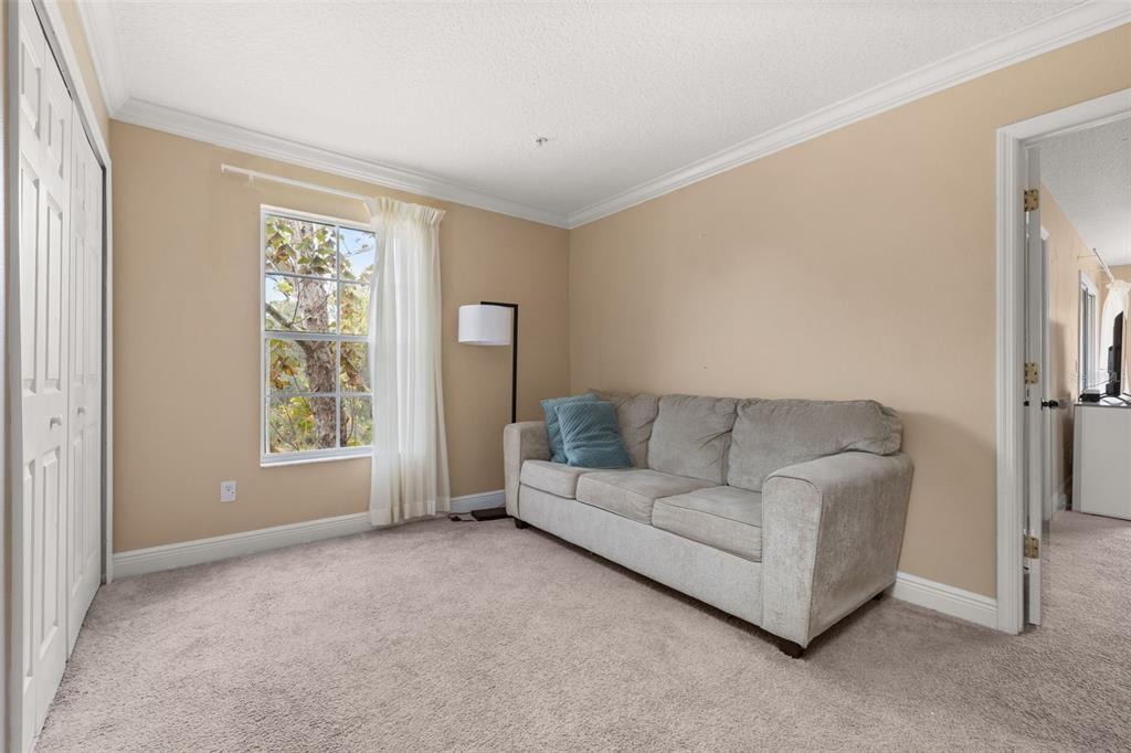 811 Assembly Court Reunion, FL 34747 - Photo 22 of 84 a living room with furniture and a window