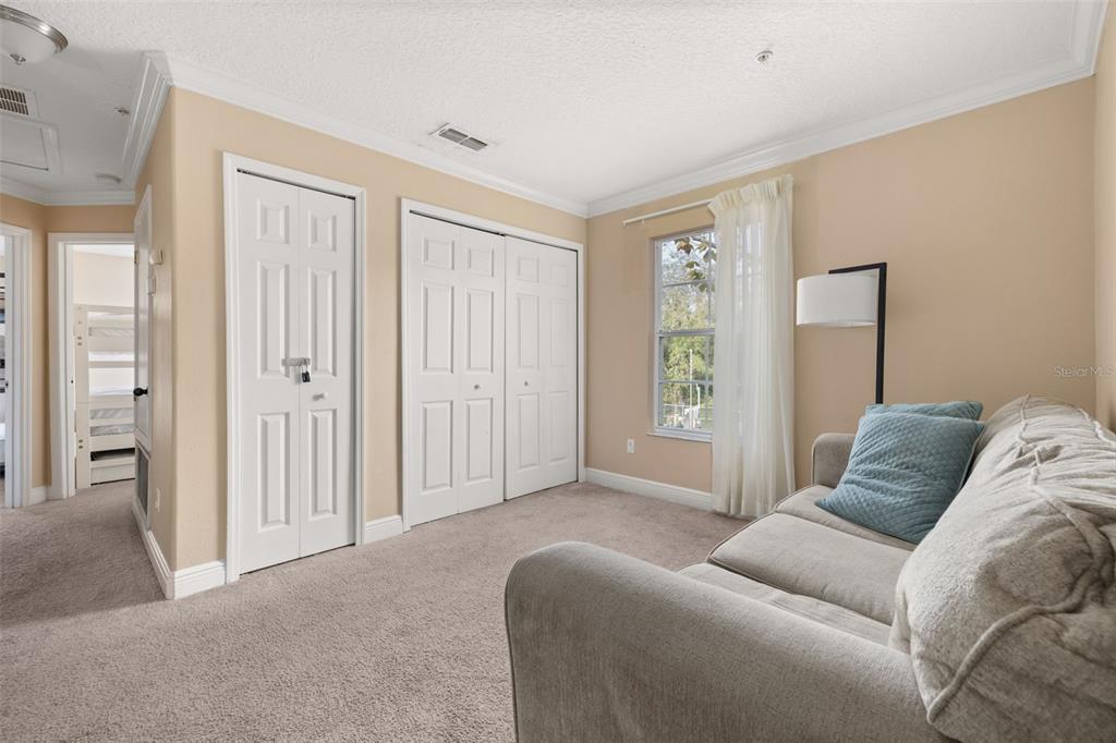 811 Assembly Court Reunion, FL 34747 - Photo 23 of 84 a living room with furniture and a window