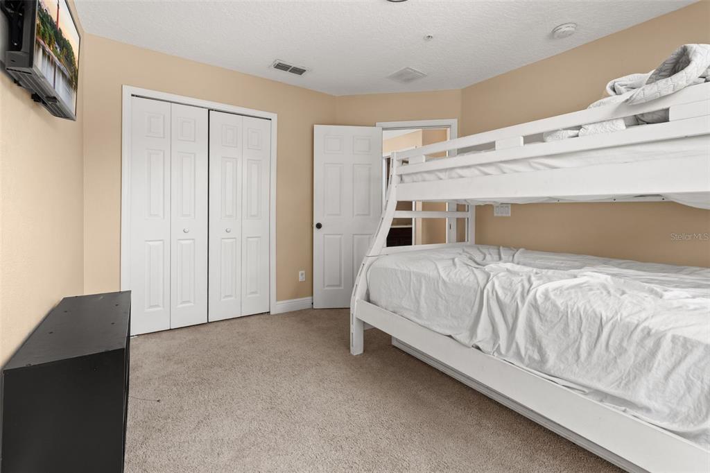 811 Assembly Court Reunion, FL 34747 - Photo 27 of 84 a large white bed in a white room