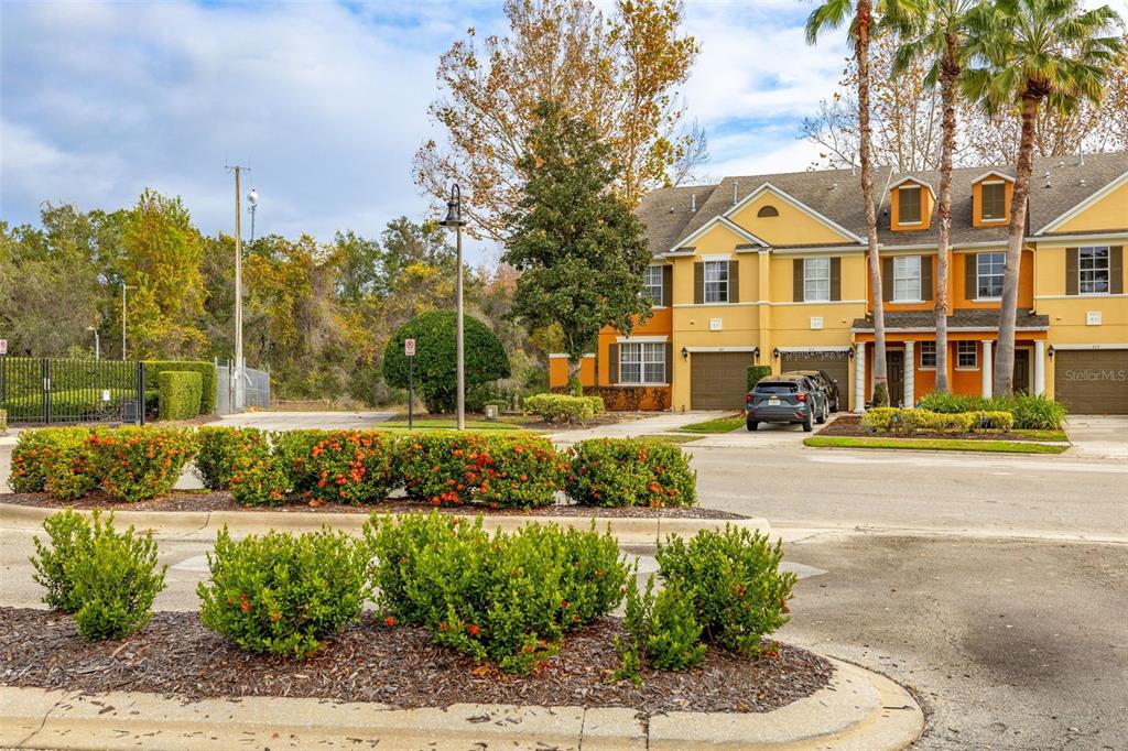 811 Assembly Court Reunion, FL 34747 - Photo 4 of 84 a front view of a house with a garden