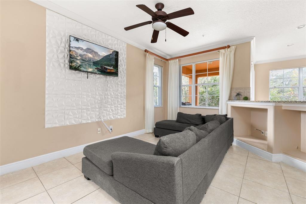 811 Assembly Court Reunion, FL 34747 - Photo 8 of 84 a living room with furniture and a window