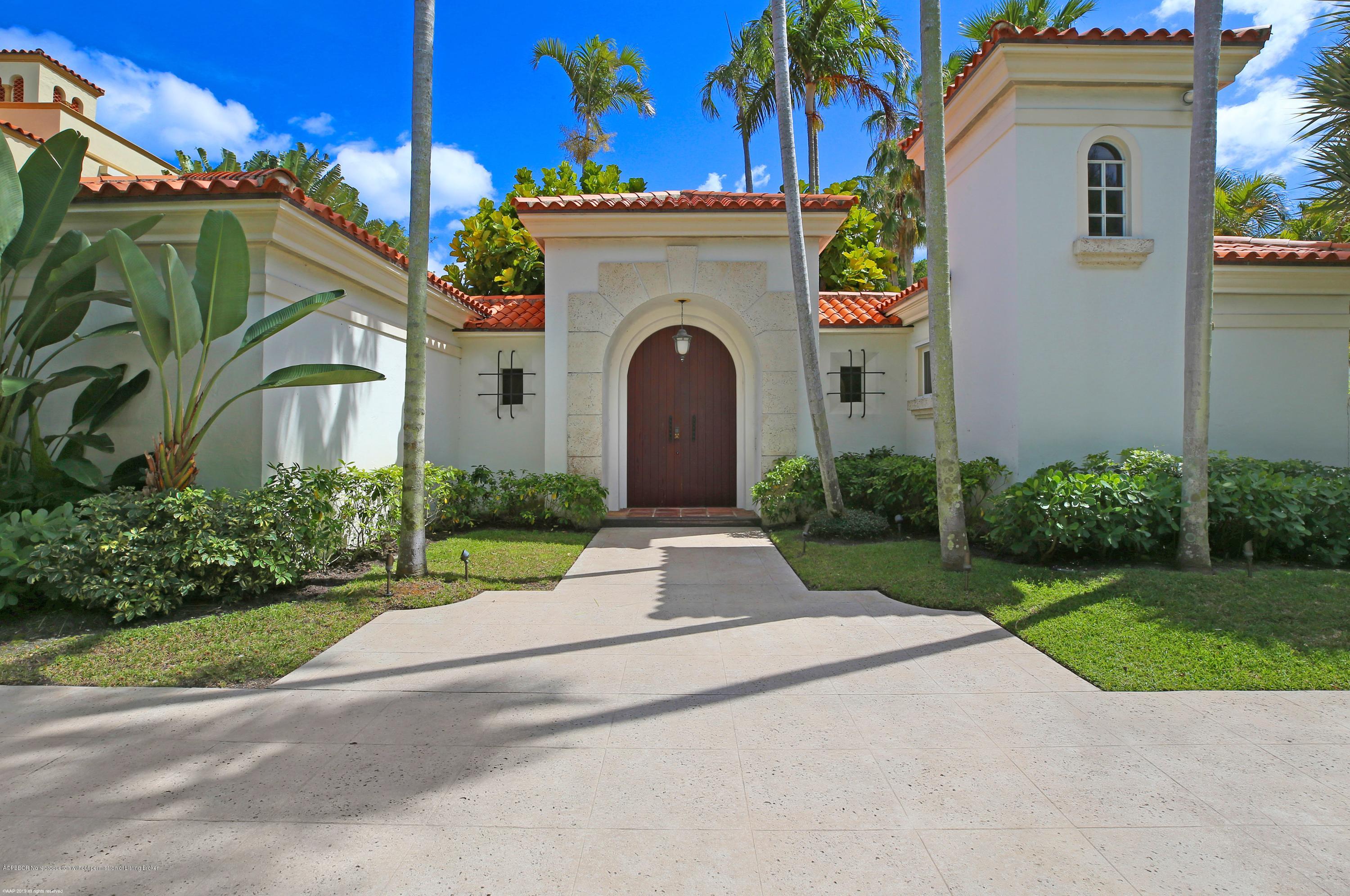 210 Wells Road Palm Beach, FL 33480 - Photo 11 of 65 a front view of a house with a garden