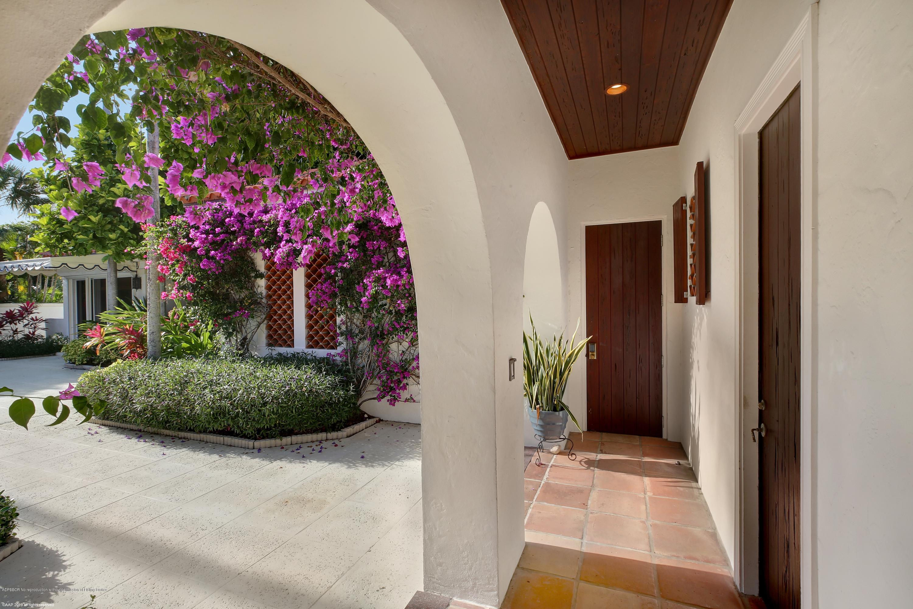 210 Wells Road Palm Beach, FL 33480 - Photo 12 of 65 a front view of a house