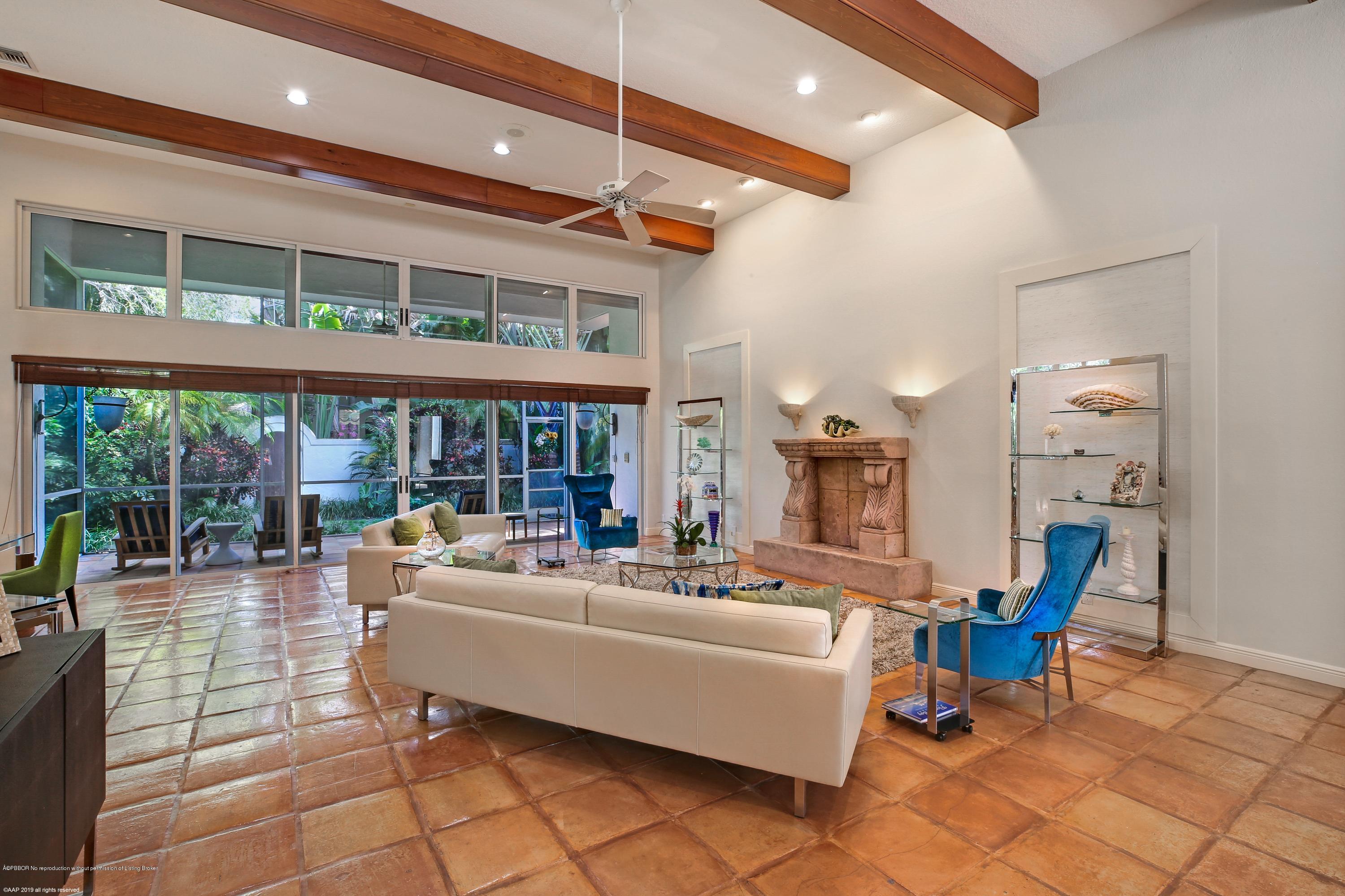 210 Wells Road Palm Beach, FL 33480 - Photo 15 of 65 a living room with furniture and a large window