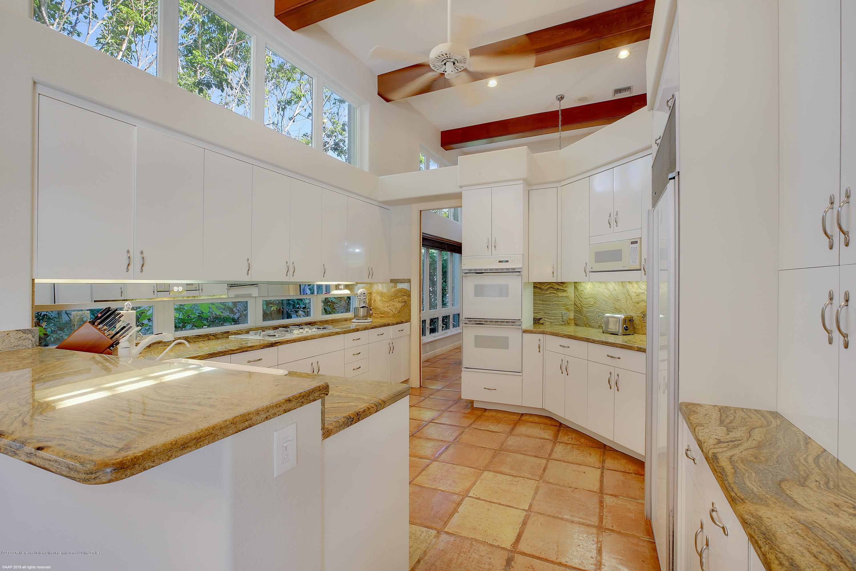 210 Wells Road Palm Beach, FL 33480 - Photo 19 of 65 a kitchen with stainless steel appliances granite countertop a sink and cabinets