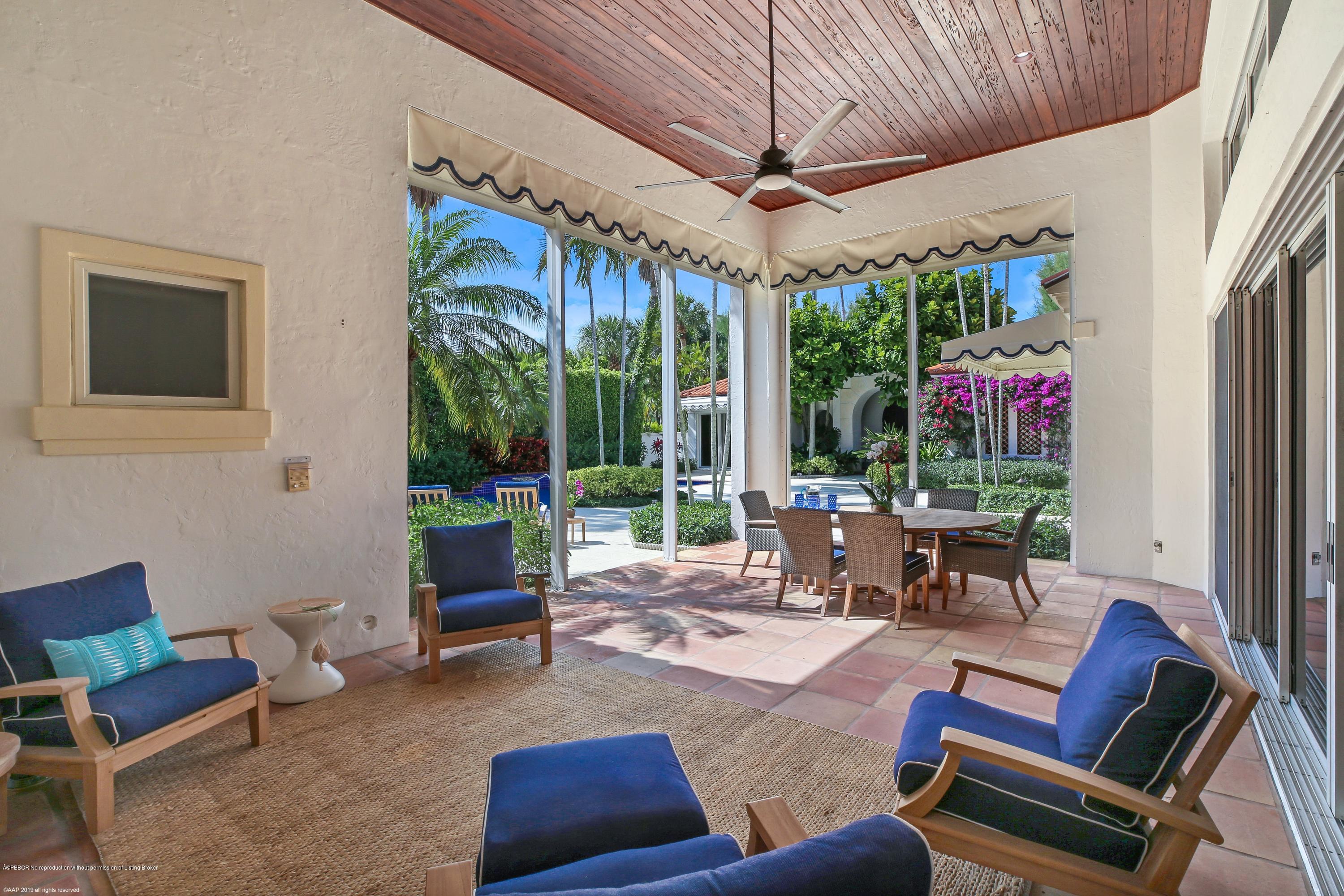 210 Wells Road Palm Beach, FL 33480 - Photo 22 of 65 a outdoor living space with furniture and garden view