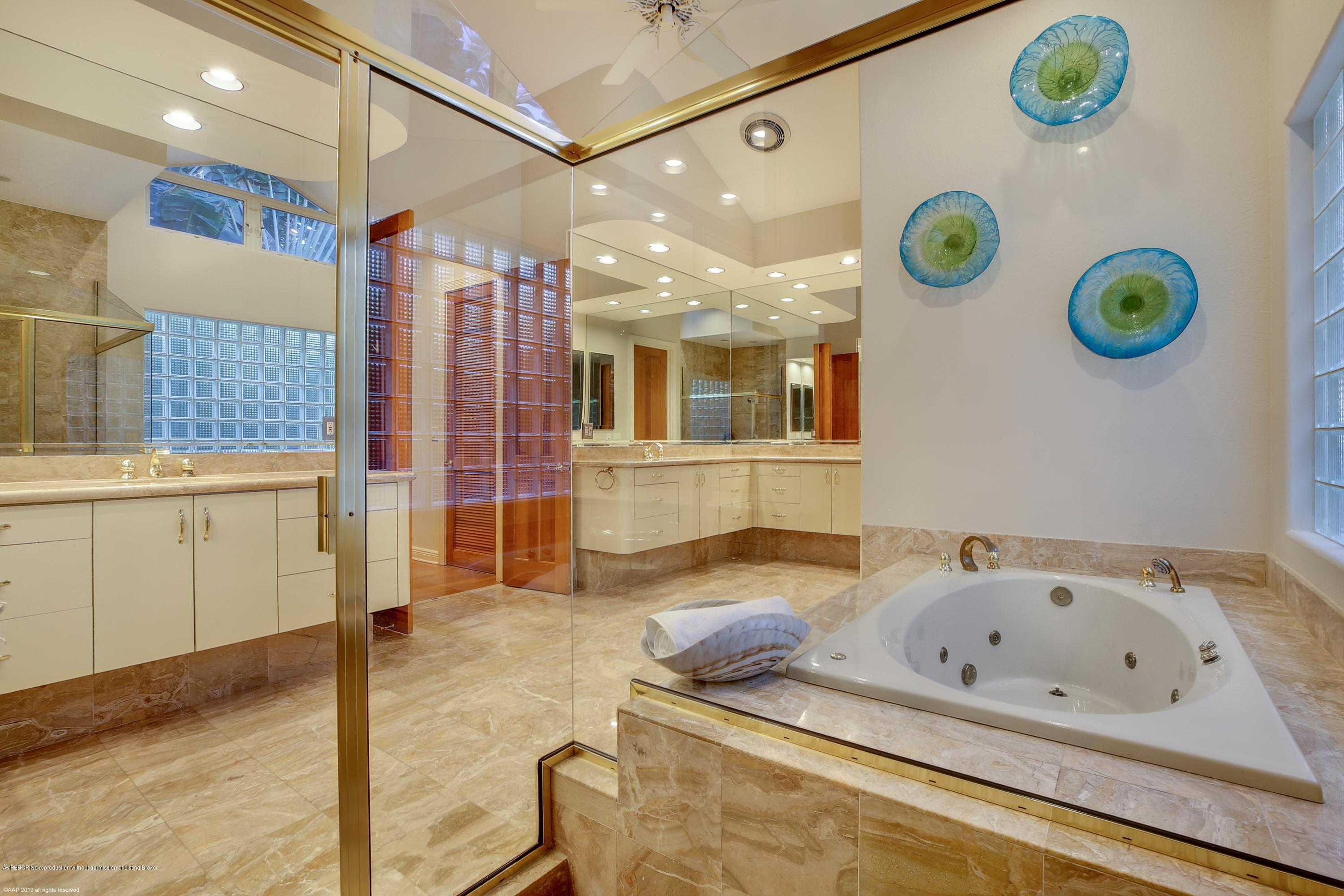 210 Wells Road Palm Beach, FL 33480 - Photo 28 of 65 a bathroom with a tub and a sink