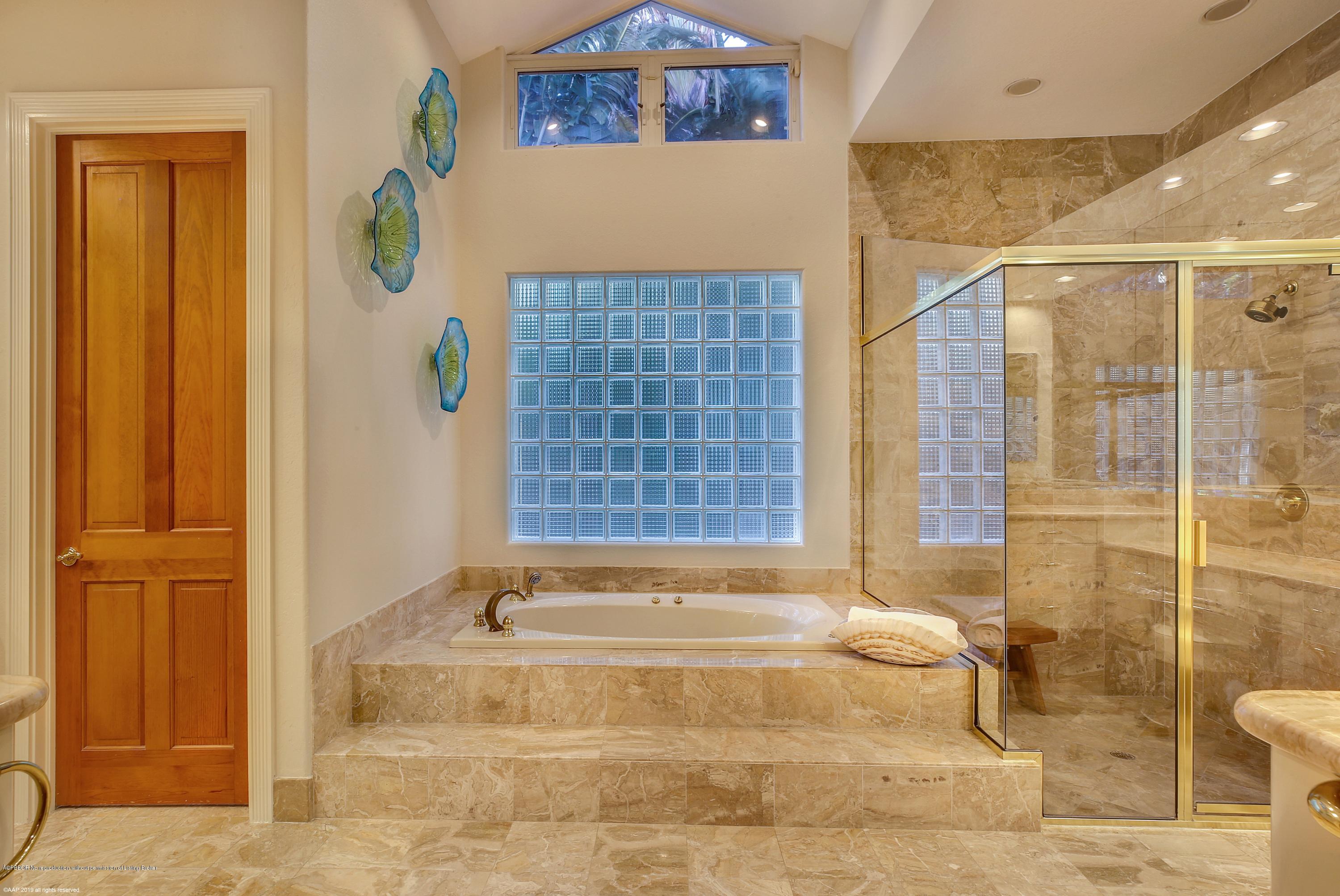 210 Wells Road Palm Beach, FL 33480 - Photo 29 of 65 a bathroom with a bathtub and shower